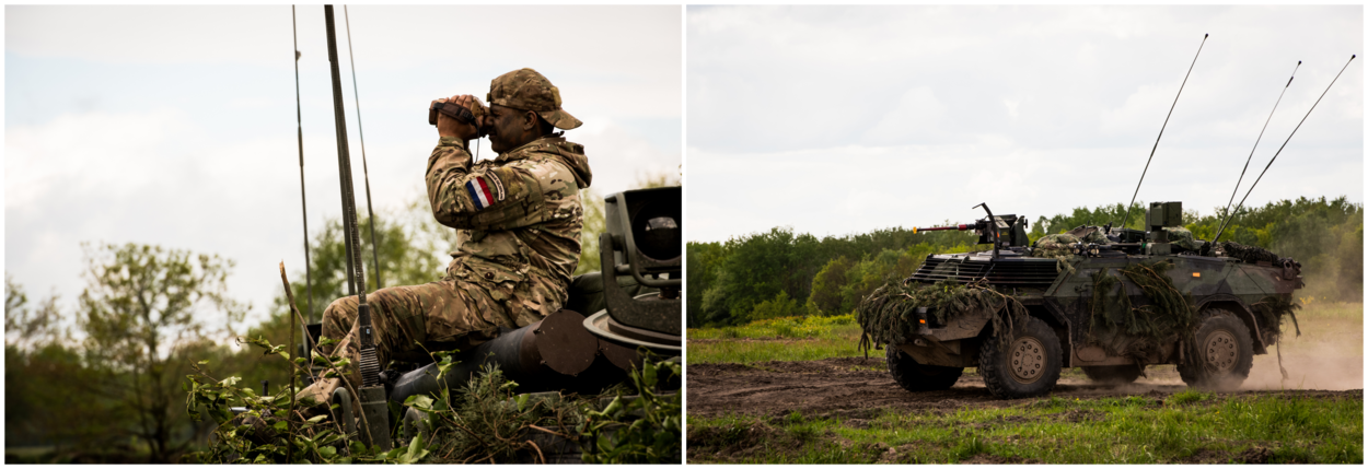 Een militair kijkt door een verrekijker en een rijdend militair voertuig.