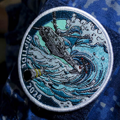 De badge van Riptide.